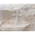 Marble stone with long cross engraved on it